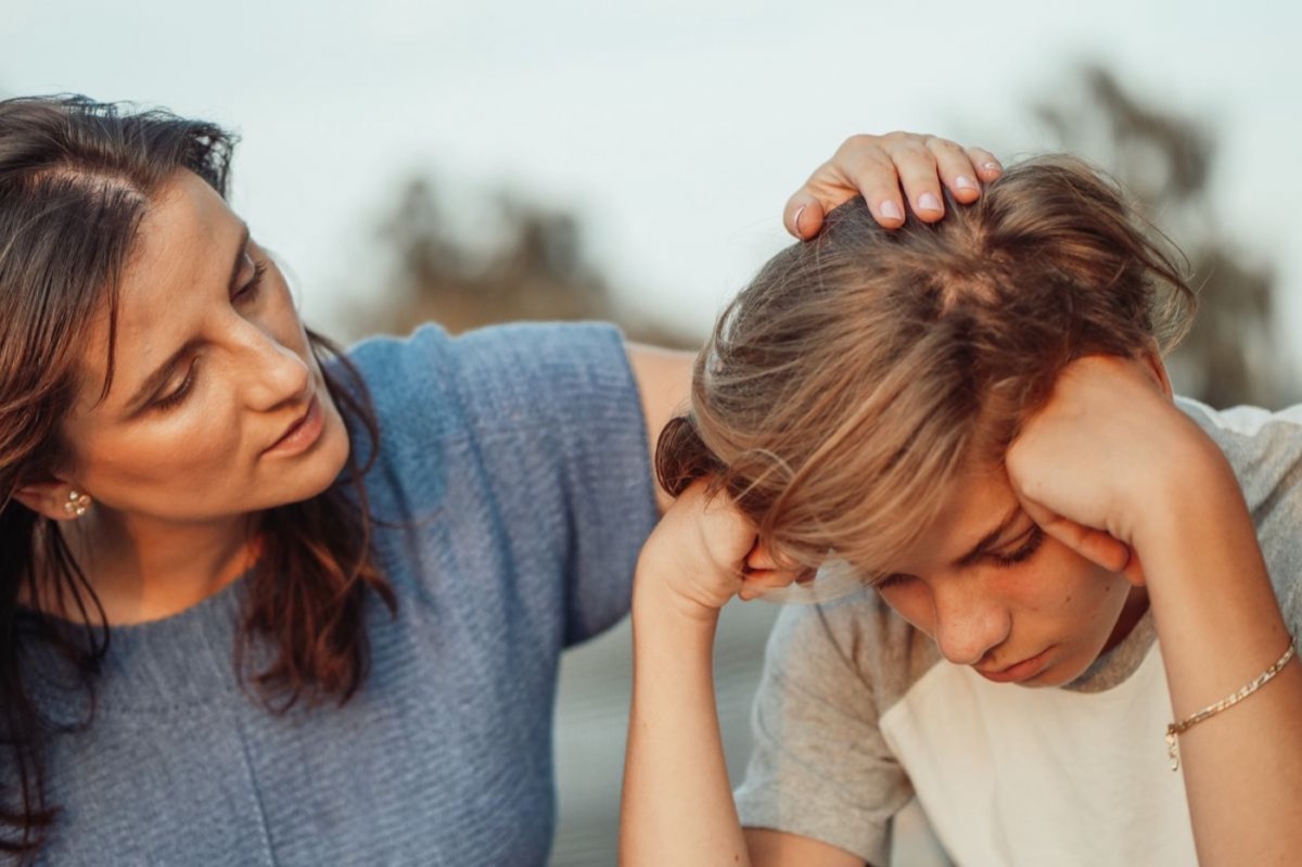 A parent comforting their child
